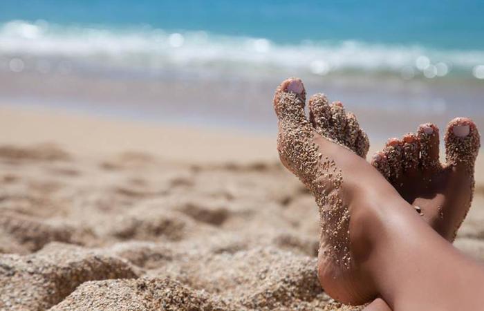 feet in the sand.jpg.838x0 q67 crop smart